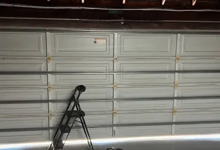 Off-track door repaired — after